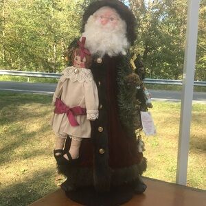 Overly-Raker Santa with doll Christmas journey 1995